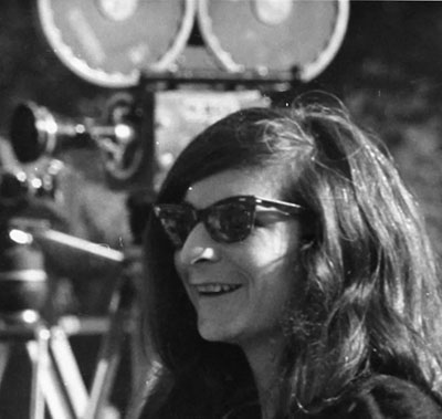 photo of roz payne with movie camera behind her