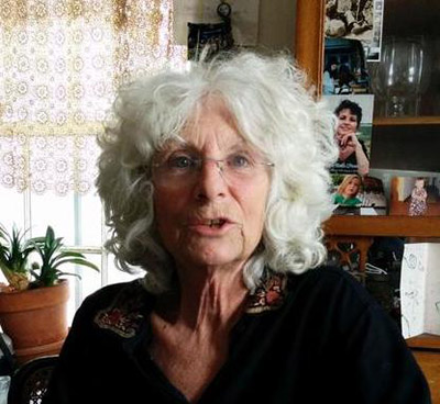 photo of roz payne in front of a bookcase